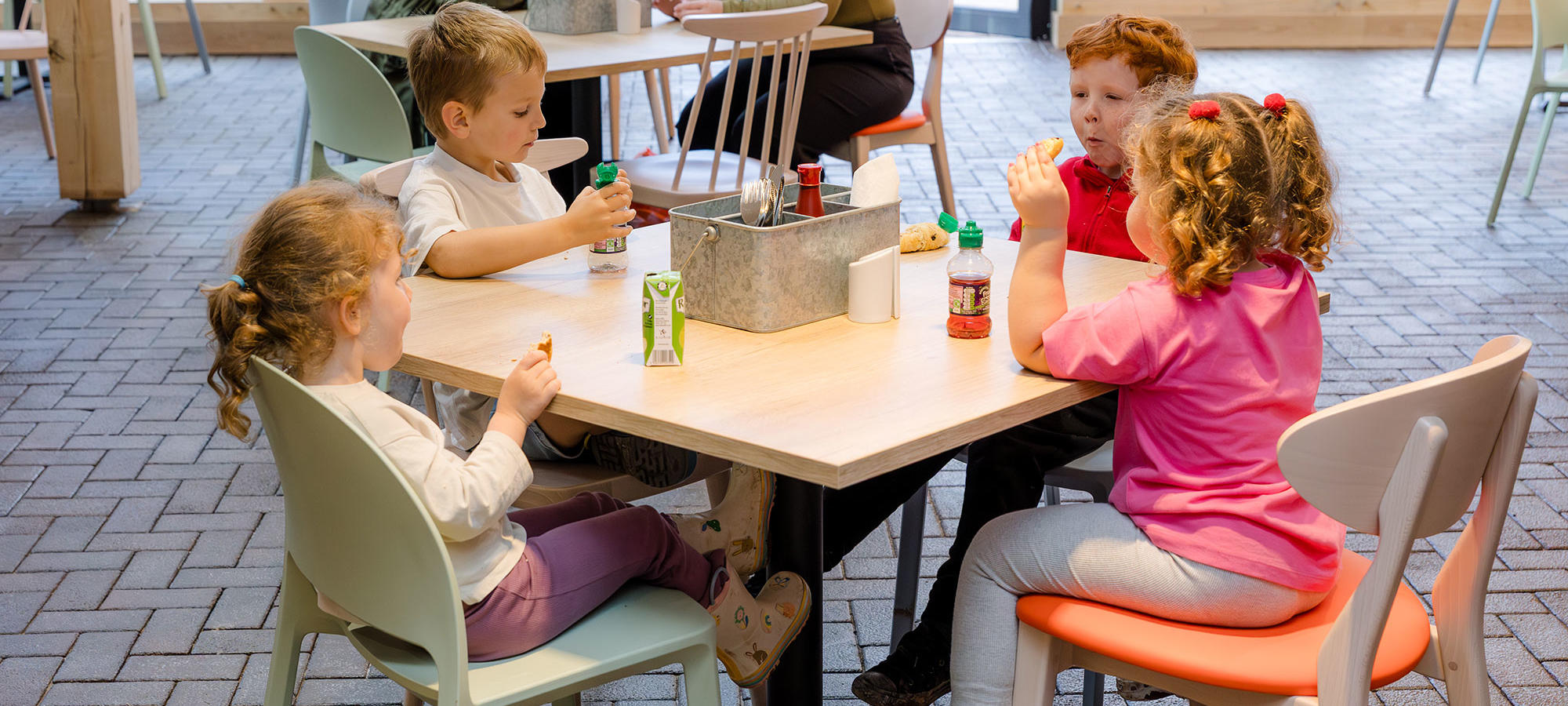 Children enjoying a snack in The Farmers Table restaurant
