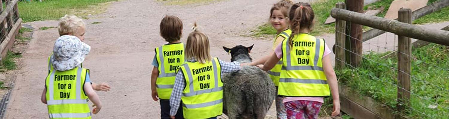 Children taking part in the Farmer for a Day experience