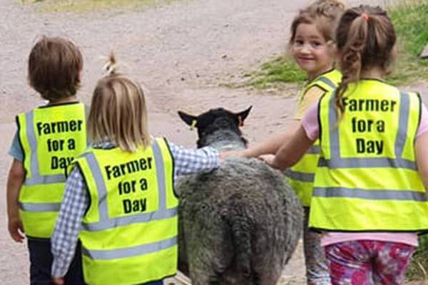 Children taking part in the Farmer for a Day experience
