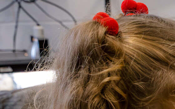 Young girl with a tortoise in the cuddle corner